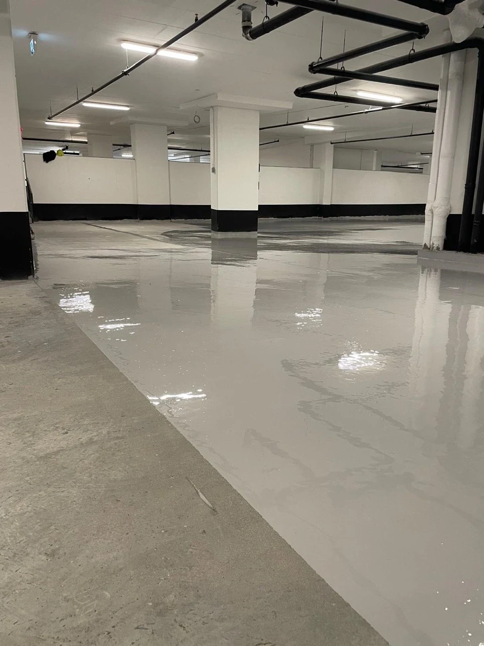Original Allenbury photograph of coating application beside exposed concrete